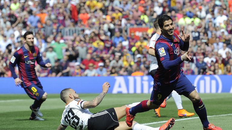 Luis Suarez celebrates after putting Barcelona 1-0 up against Valencia CF at the Camp Nou