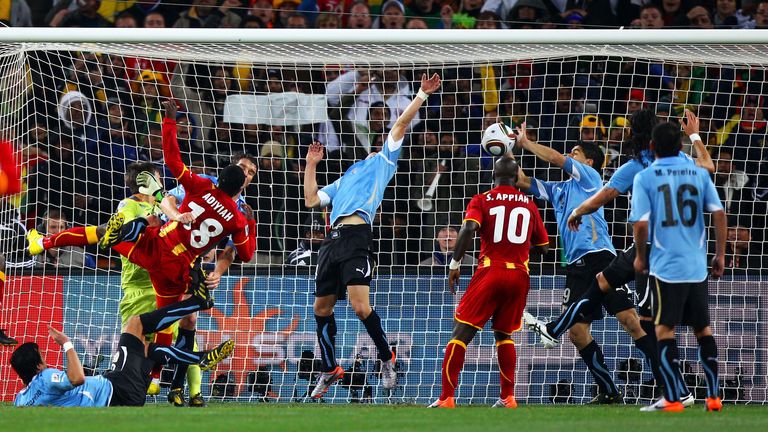 JOHANNESBURG, SOUTH AFRICA - JULY 02:  Luis Suarez of Uruguay handles the ball on the goal line, for which he is sent off, during the 2010 FIFA World Cup S