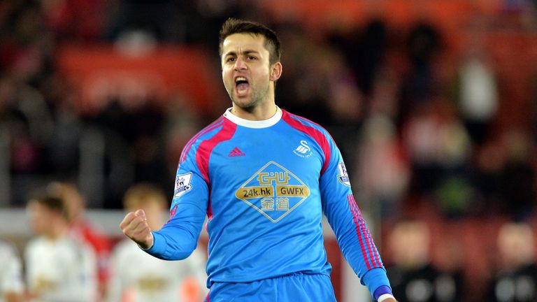 Swansea City's Polish goalkeeper Lukasz Fabianski  celebrates at the end of the English Premier League football match between Southampton and Swansea