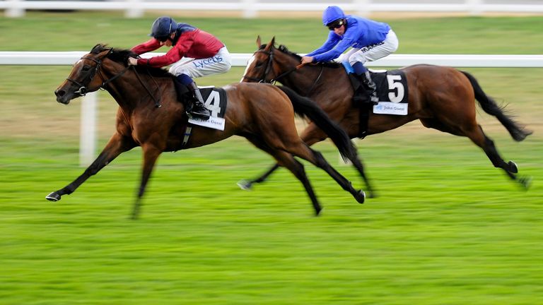 ASCOT, ENGLAND - JULY 25:  William Twiston-Davies riding Malabar win The John Guest EBF Stallions Maiden Fillies' Stakes at Ascot racecourse on July 25, 20