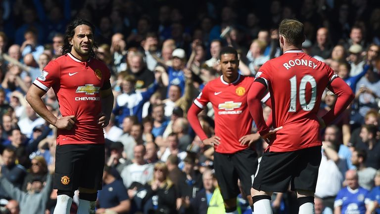 Manchester United's English striker Wayne Rooney and Manchester United's Colombian striker Radamel Falcao wait to kick off following Everton's third goal 