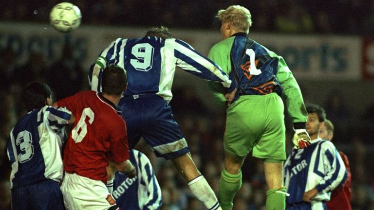 Peter Schmeichel of Manchester United heads in a goal during the UEFA Cup first round second leg match against Rotor Volgograd at Old Trafford