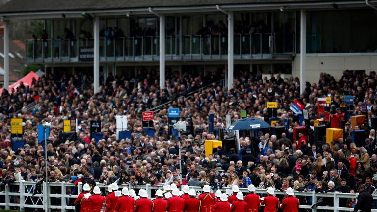 A band plays in front of a packed grandstand at Lingfield 