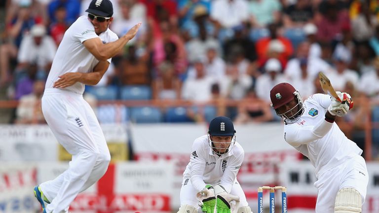 Alastair Cook leaps to avoid a cover drive from Marlon Samuels 