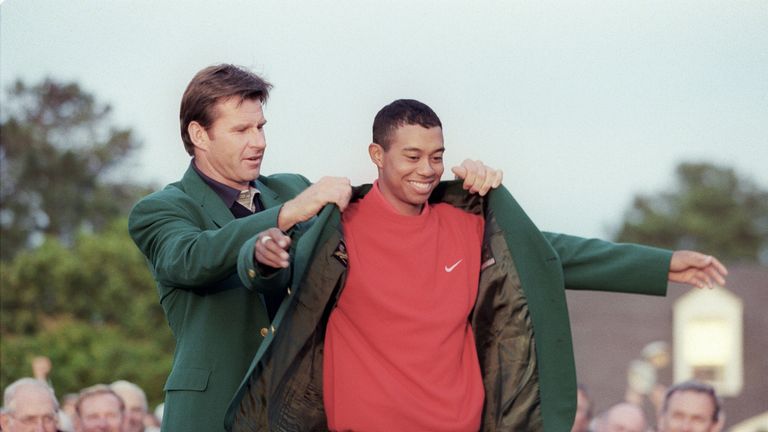 Tiger Woods receives the Masters green jacket from  Nick Faldo after Woods won the 1997 Masters tournament on 13 April 1997 at Augusta 