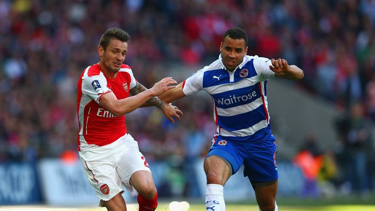 Mathieu Debuchy of Arsenal and Hal Robson-Kanu of Reading compete for the ball during the FA Cup Semi Final