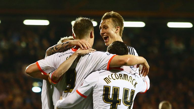 Matt Smith of Fulham (2L) celebrates with team mates