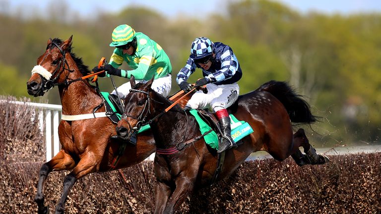 ESHER, ENGLAND - APRIL 25: Leighton Aspeil (R) rides Off The Ground to win The bet365 Oaksey Steeple Chase at Sandown racecourse on April 25, 2015 in Esher