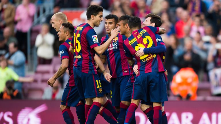 Team-maters congratulate Lionel Messi after his brilliant penalty