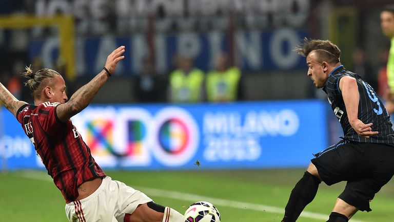 Philippe Mexes of Milan and Xherdan Shaqiri of Internazionale in action during the Serie A match between the sides