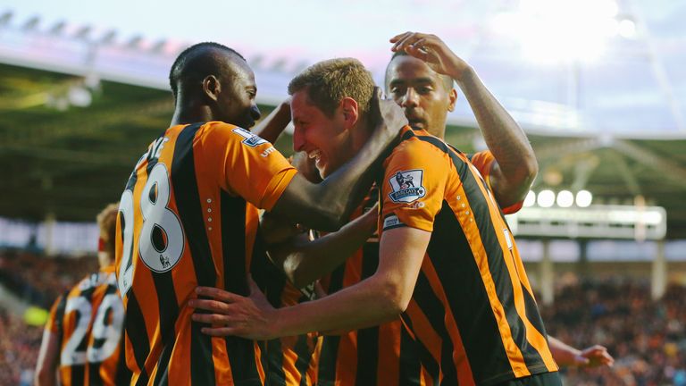 Michael Dawson of Hull City (C) celebrates with team mates as he scores their first goal during the match between Hull City and Liverpool