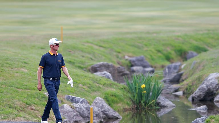 Mikko Ilonen of Finland walk to eighth hole during the day two of the Volvo China Open.