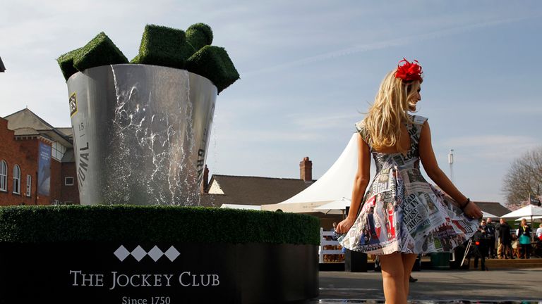 Lydia Brown poses for photographers on Ladies Day of the Crabbies Grand National Festival