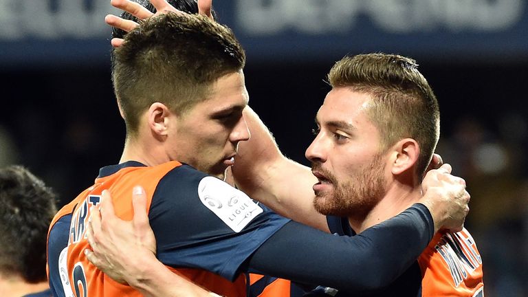 Montpellier's French forward Anthony Mounier (R) is congratuled by teammate French midfielder Jonas Martin 