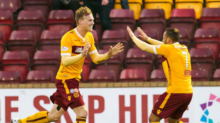 Lee Erwin celebrates with Lionel Ainsworth after scoring his second goal for Motherwell