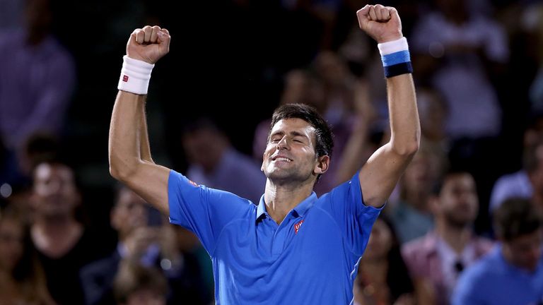 Novak Djokovic of Serbia celebrates his win over John Isner during day 12 of the Miami Open