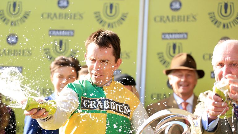Jockey Leighton Aspell celebrates after victory in the Crabbie's Grand National