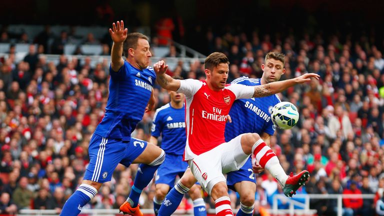 Olivier Giroud of Arsenal holds off John Terry and Gary Cahill of Chelsea, Premier League