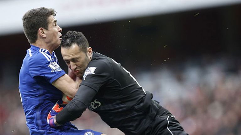 Chelsea's Oscar collides with Arsenal keeper David Ospina