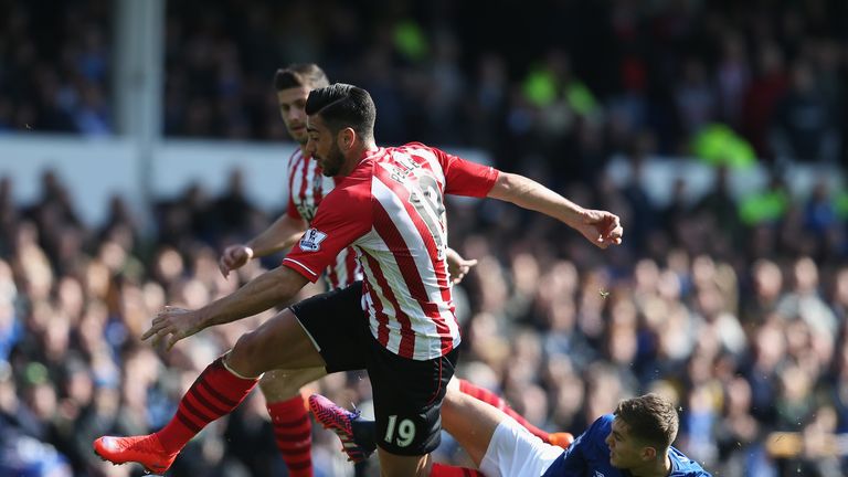 Graziano Pelle of Southampton is challenged by John Stones of Everton