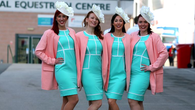 Racegoers arrive for the Grand Opening Day of the Crabbies Grand National Festival