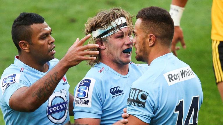 Waratahs Kurtley Beale and Michael Hooper congratulate Peter Betham after try against Wellington Hurricanes.