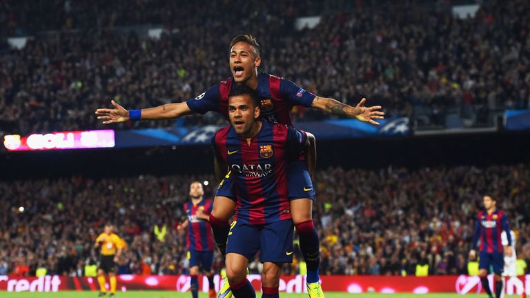 Neymar of Barcelona celebrates with Daniel Alves (front) as he scores their second goal against PSG