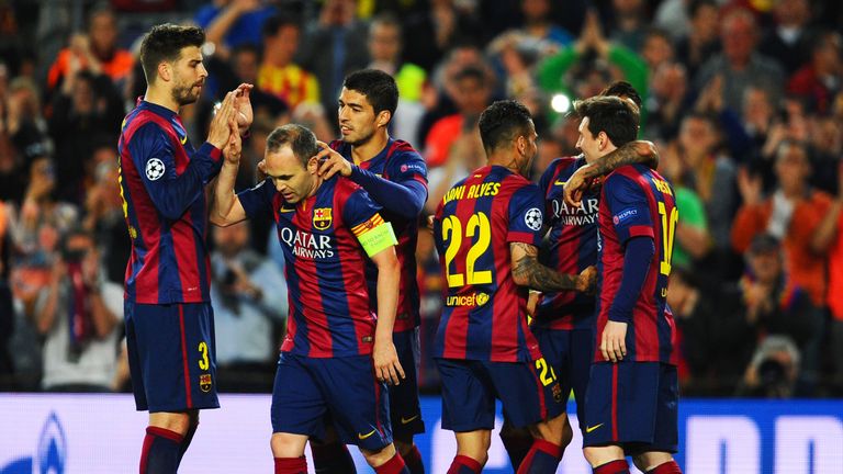 Neymar  celebrates with Barcelona team mates as he scores their first goal against Paris Saint-Germain