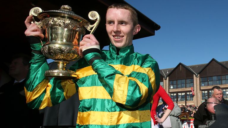 Mark Walsh with the trophy after guiding Jezki to victory in the Ladbrokes World Series Hurdle at Punchestown
