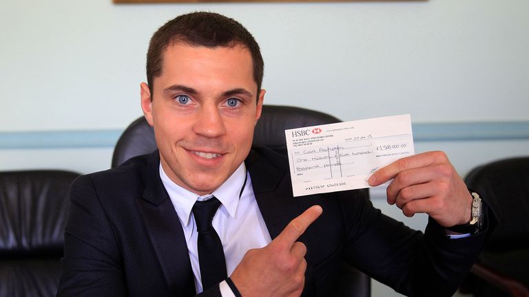 Scott Quigg with a £1.5m cheque for Carl Frampton (Lawrence Lustig)