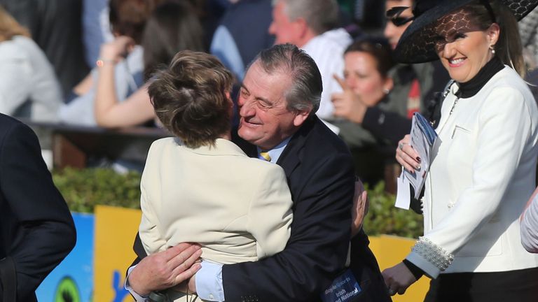 Trainer Noel Meade hugs Eileen Hughes after Thunder And Roses' victory in the BoyleSports Irish Grand National.