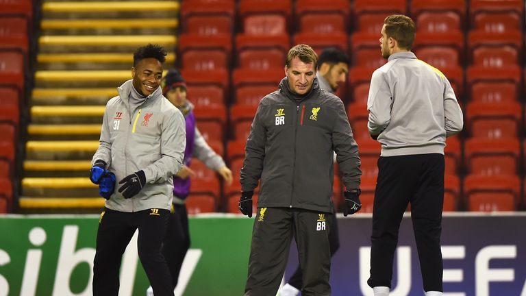 Brendan Rodgers, manager of Liverpool talks to Raheem Sterling