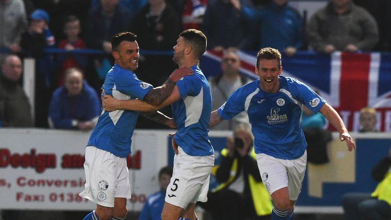 Derek Lyle (left) celebrates having opened the scoring for Queen of the South.