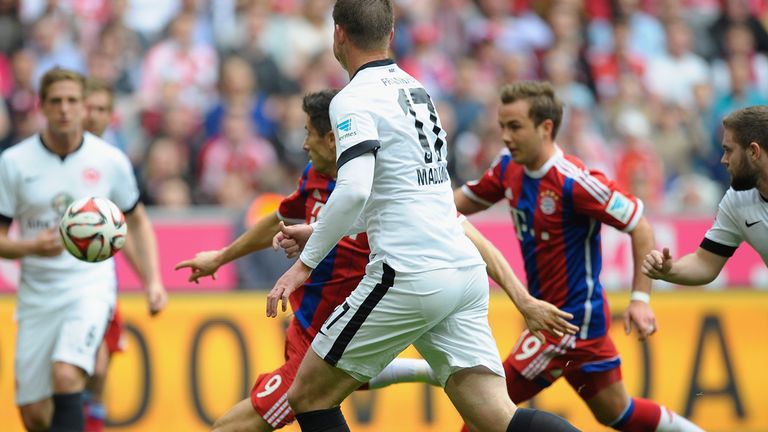 MUNICH, GERMANY - APRIL 11:  Robert Lewandowski (C) of Munich scores the opening goal during the Bundesliga 