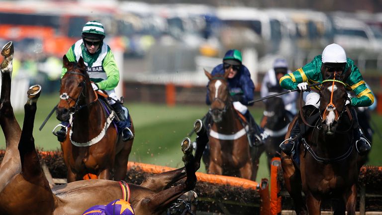 Jezki (R) clears the last as Ruby Walsh riding Arctic Fire falls