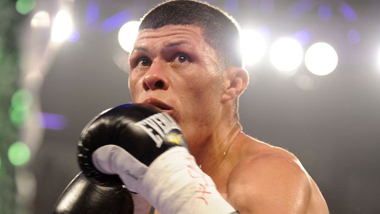 Roman Martinez looks to throw a punch at Miguel Beltran Jr. during their WBO Super Featherweight title fight in 2012