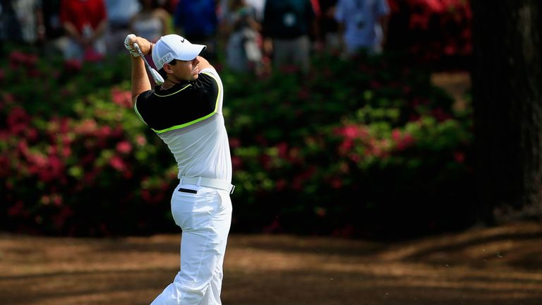 Rory McIlroy of Northern Ireland watches a shot on the second hole during the first round of the 2015 Masters Tournament at Augusta