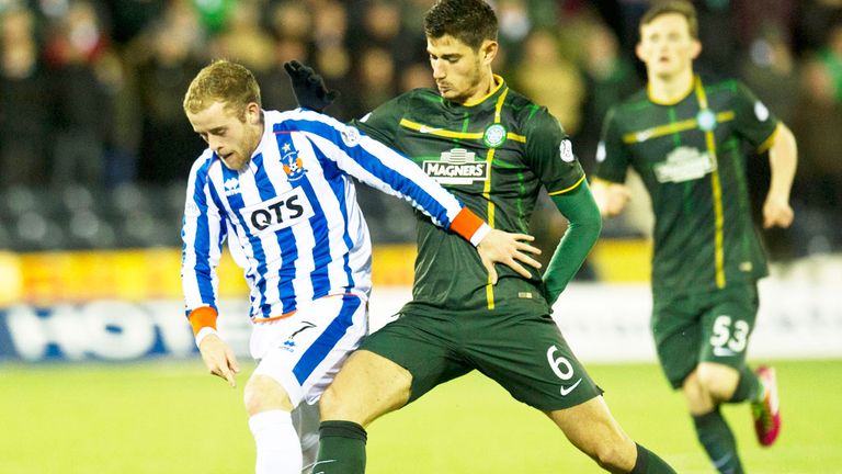 Kilmarnock's Rory McKenzie is challellnged by Nir Bitton (r) of Celtic
