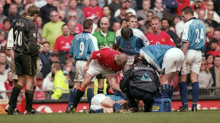 Manchester United's Roy Keane stands over Manchester City's Alf-Inge Haaland following his foul at Old Trafford in April 2001