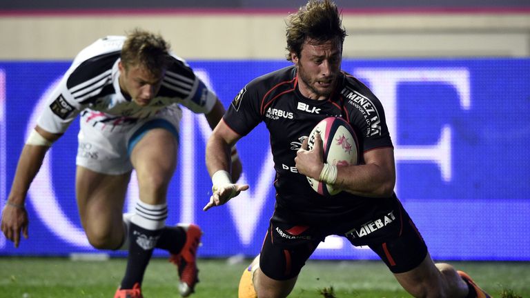 Toulouse full-back Maxime Medard scores a try in front of France team-mate Jules Plisson