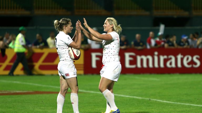 Natasha Hunt of England is congratulated after scoring the winning try against Fiji