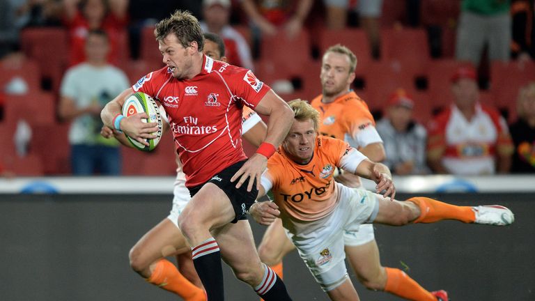 Ruan Combrinck of the Lions beats Joe Pietersen of the Cheetahs to run in for his try