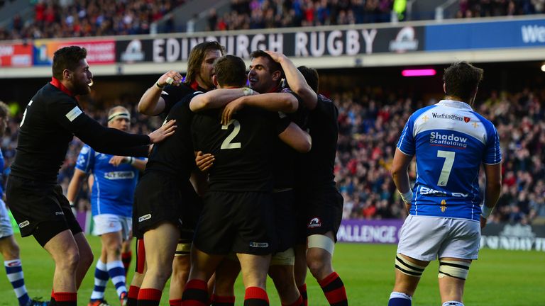 Stuart McInally of Edinburgh is congratulated after scoring a try against the Dragons
