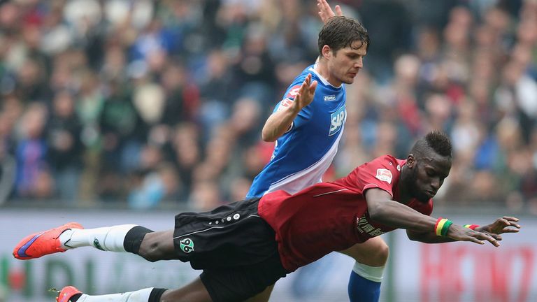 HANOVER, GERMANY - APRIL 25:  Salif Sane of Hannover and Pirmin Schwegler of Hoffenheim compete for the ball 