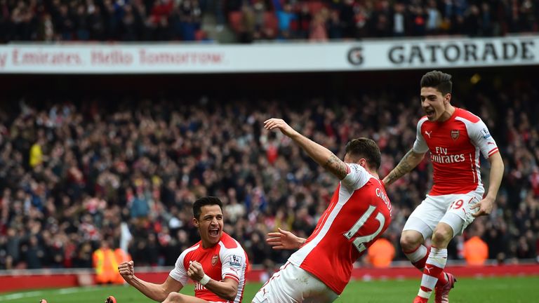 Arsenal's Chilean striker Alexis Sanchez celebrates with teammates
