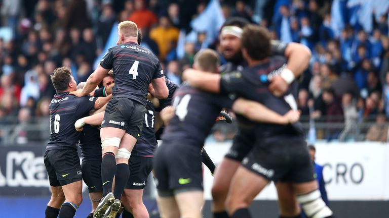 Saracens players celebrate victory against Racing Metro 