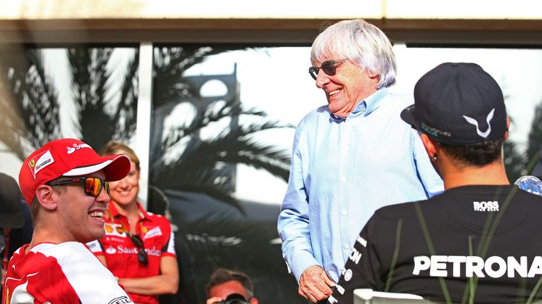 Bernie Ecclestone shares a joke with Sebastian Vettel and Lewis Hamilton
