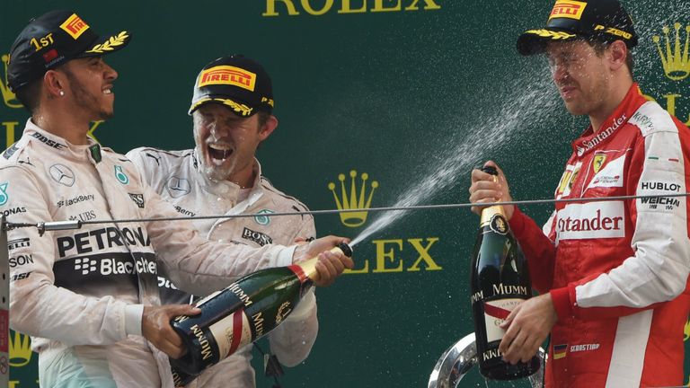 Lewis Hamilton celebrates on the Shanghai podium with Sebastian Vettel and Nico Rosberg