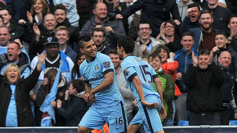 Manchester City's Sergio Aguero (L) celebrates scoring with Jesus Navas (R)