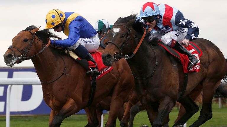 Speculative Bid, ridden by Jamie Spencer, (right) catches Outback Traveller to score at Kempton